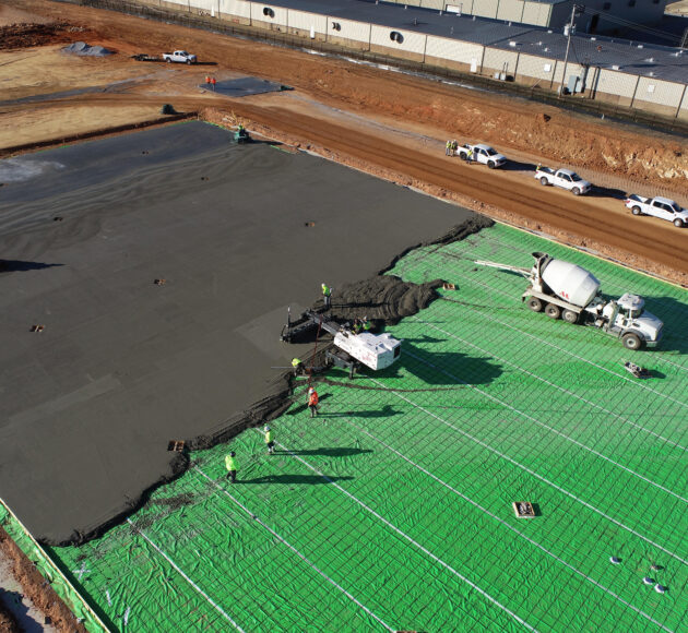 Process of pouring concrete slab at Amazon facility